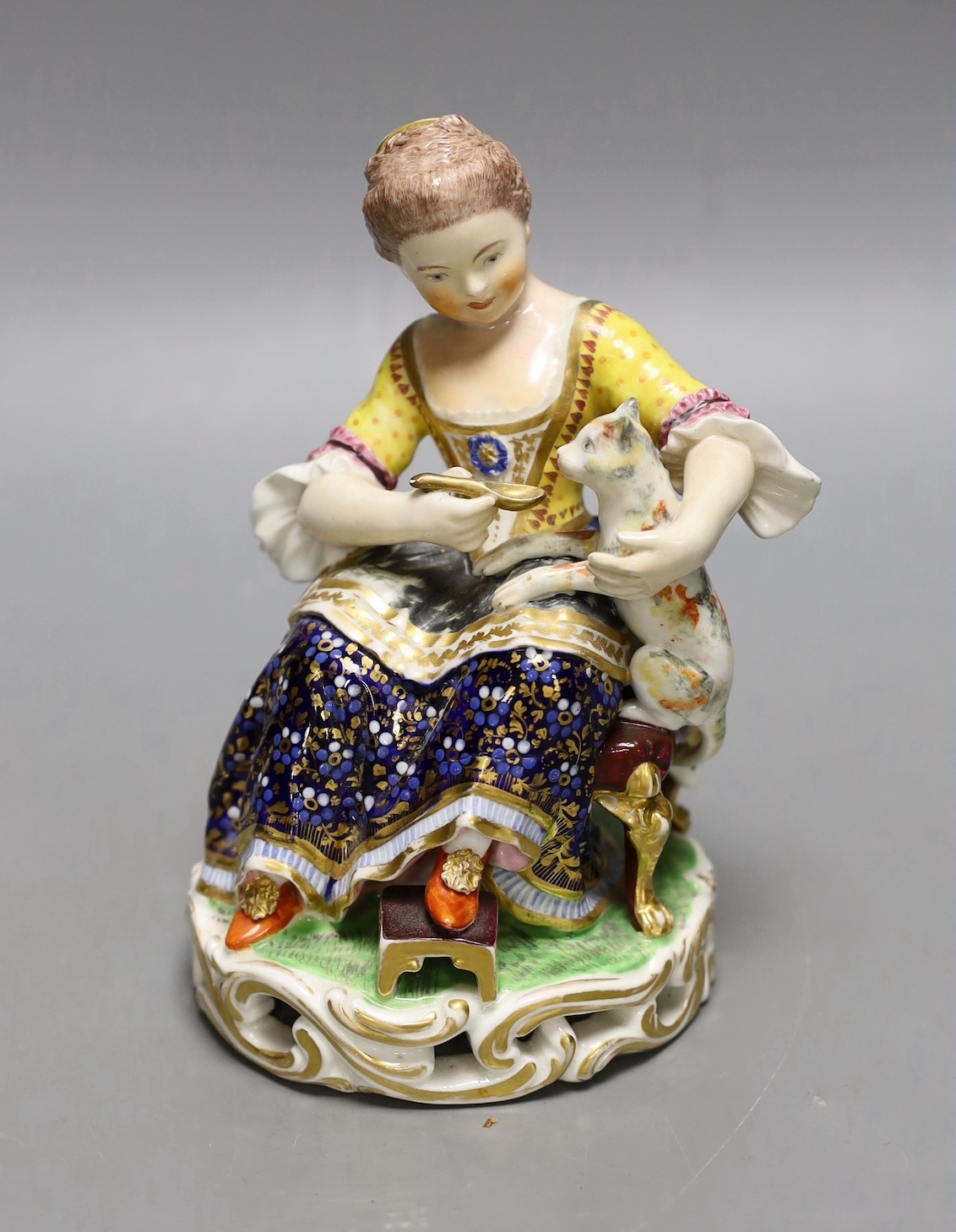 A Bloor Derby porcelain figure of a lady feeding a cat with a spoon, c.1820, No. 362, 15cm tall.